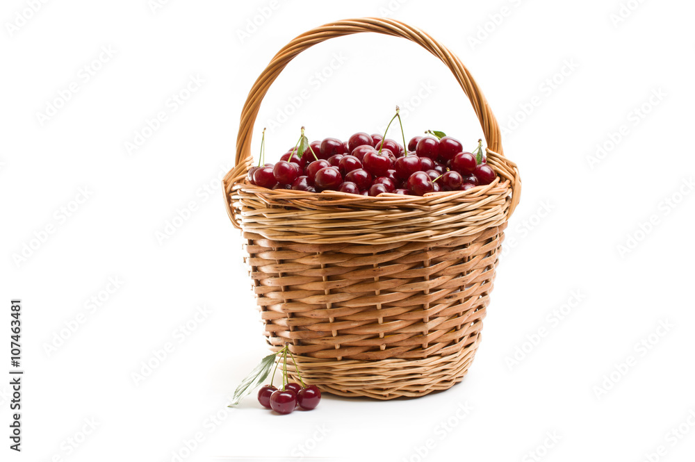 Basket full of fresh red cherry on a white background Basket full of fresh red cherry on a white background