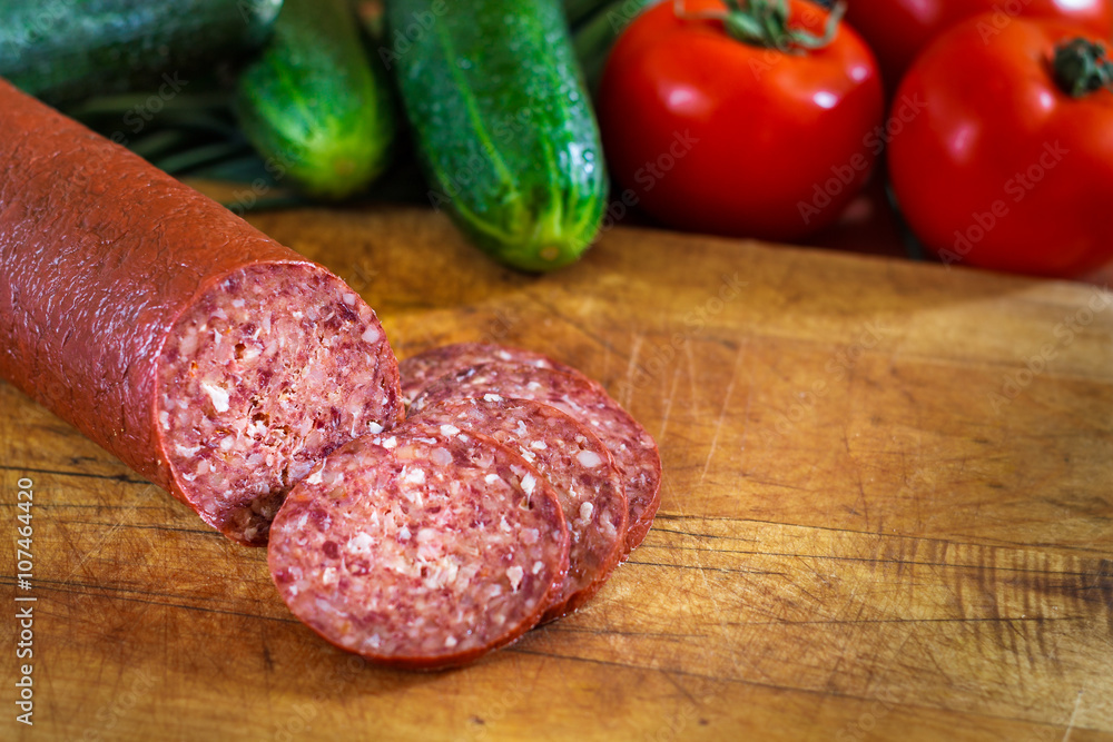 Sujuk sausage on cutting board Sujuk sausage on cutting board