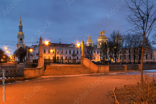 Krasnogvardeyskiy bridge and St. Nicholas Naval Cathedral illuminated at night, HDR, St. Petersburg, Russia.