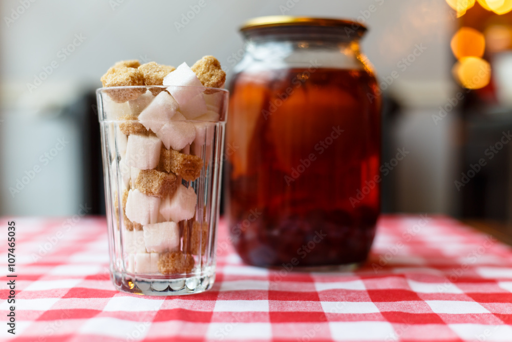 White and brown sugar in a glass beaker and the Bank with compot White and brown sugar in a glass beaker and the Bank with compot