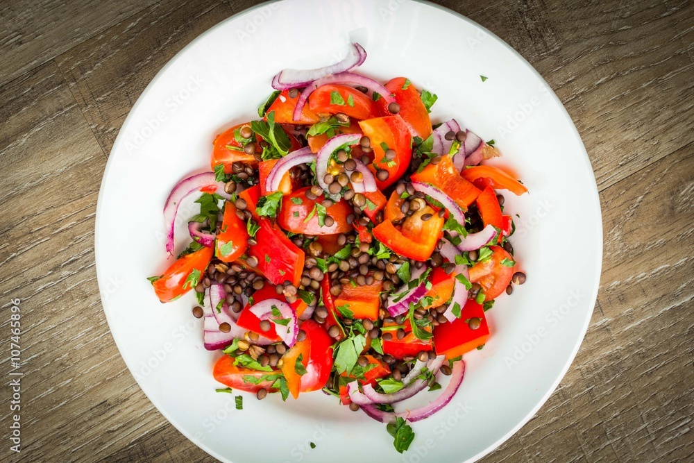 Fresh healthy salad with tomatoes, lentils, grilled cheese Fresh healthy salad with tomatoes, lentils, grilled cheese