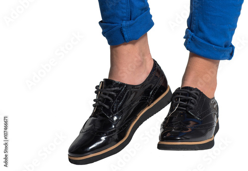 Footwear. Stylish boots on legs. Close up. High fashion shoes