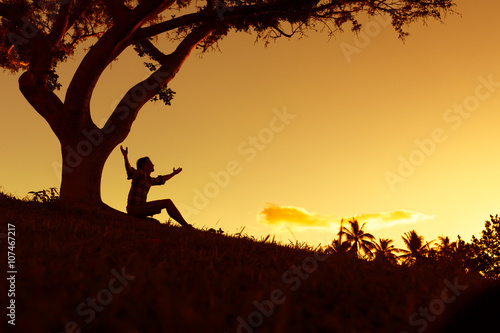 Young man feeling free in a beautiful outdoor setting.