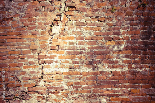 Old cracked brick wall background