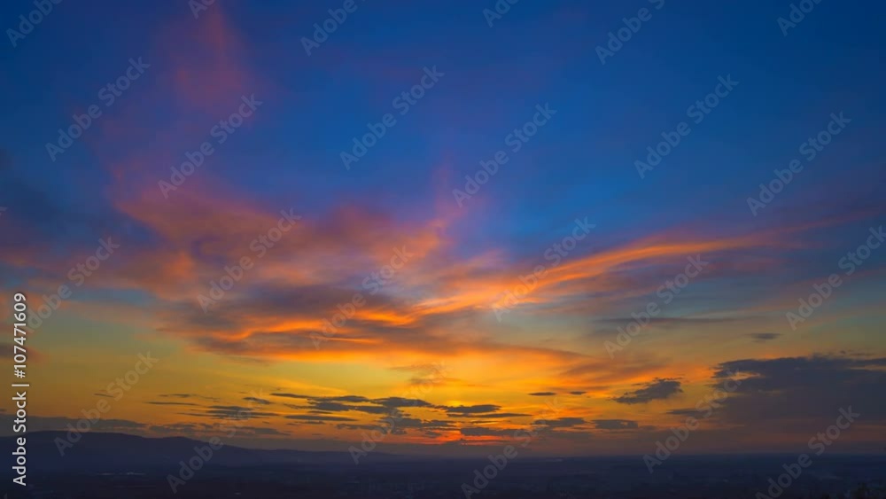 The flow of cloud on a background of the evening city. Real time capture The flow of cloud on a background of the evening city. Real time capture