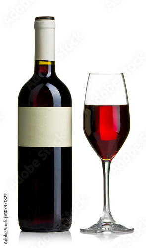 Red wine bottle with empty labels and the glass filed with red wine isolated