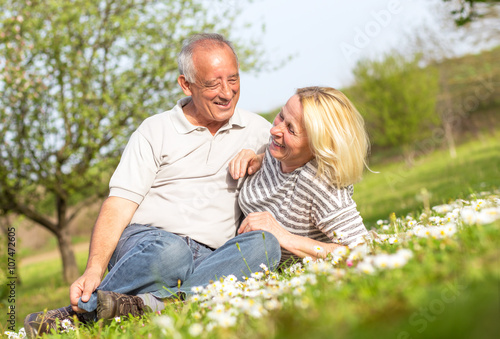 Senior couple in love enjoying togetherness outdoor.