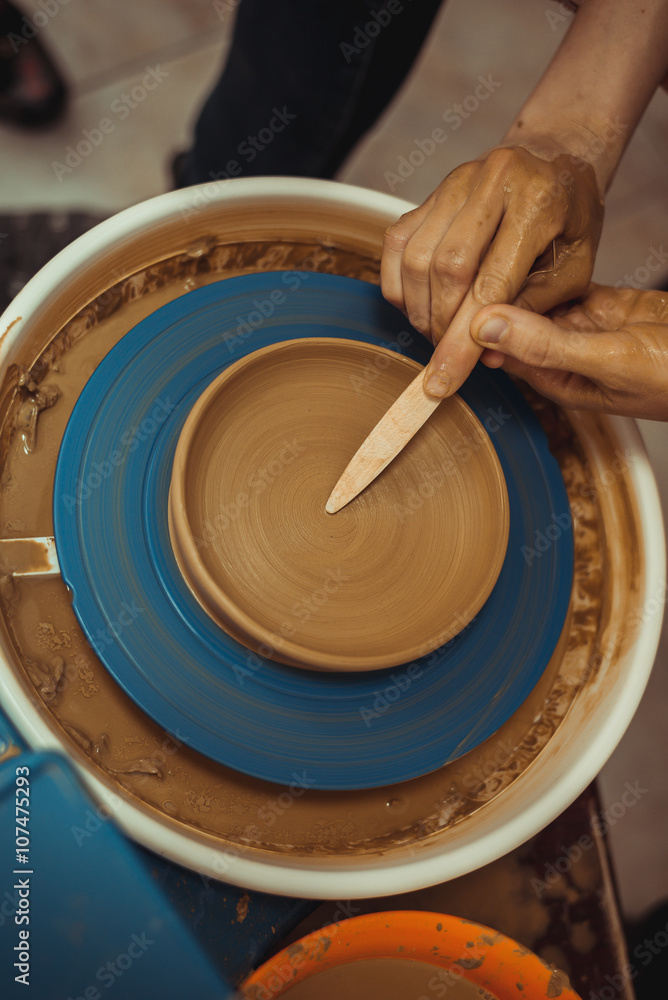 Fototapeta premium man working on a potter's wheel