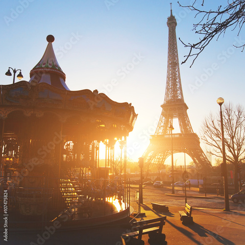 Photography carousel at Eiffel tower in Paris, sunny day, France