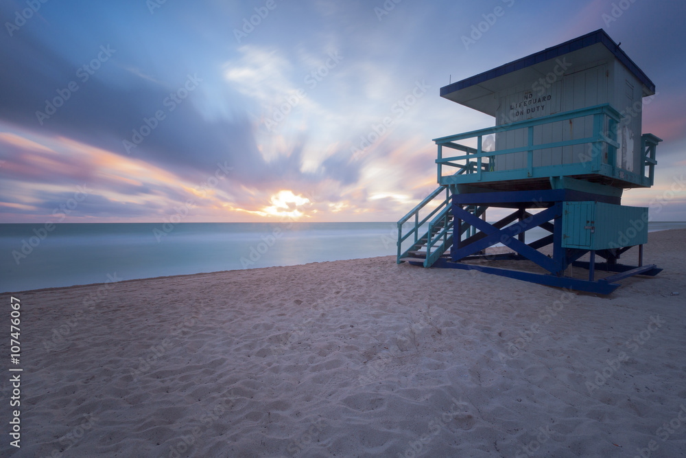 Sunrise in Miami Beach with a lifeguard post Sunrise in Miami Beach with a lifeguard post
