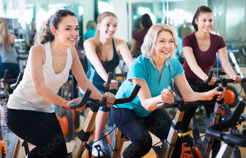 Females training on exercise bikes