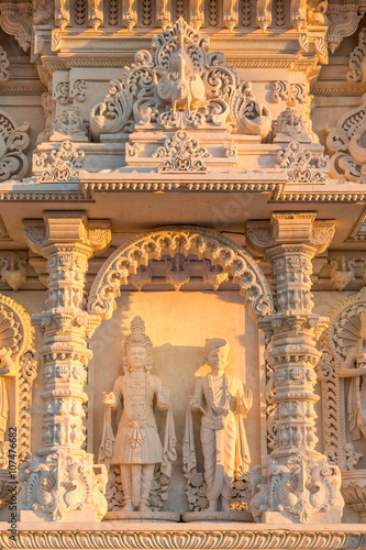Facade of a hindu temple representing the god Swamy Narayan (Swaminarayan) and his disciple photo