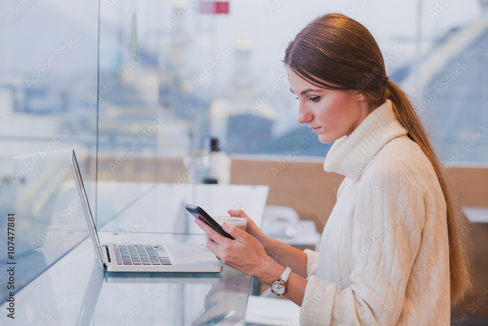 woman using smart phone in modern cafe inerior, mobile application, checking email woman using smart phone in modern cafe inerior, mobile application, checking email