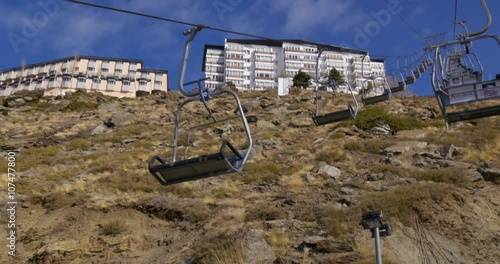 day time ski lift riding up on mountain early winter 4k spain