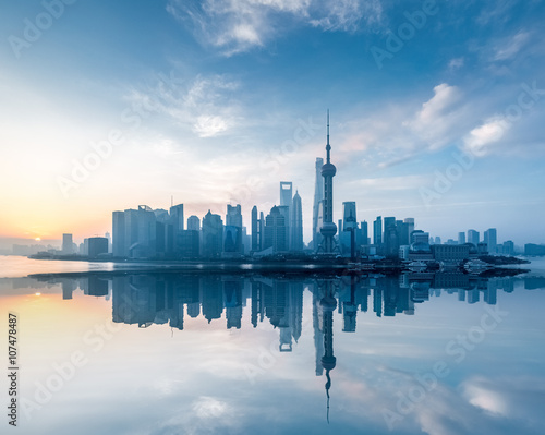 shanghai skyline with reflection in sunrise