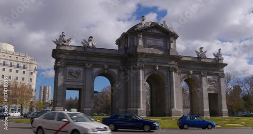 madrid traffic circle puerta de alcala sun light day 4k spain

