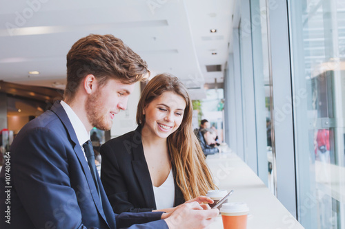 business people chatting in cafe at lunch or coffee break photo