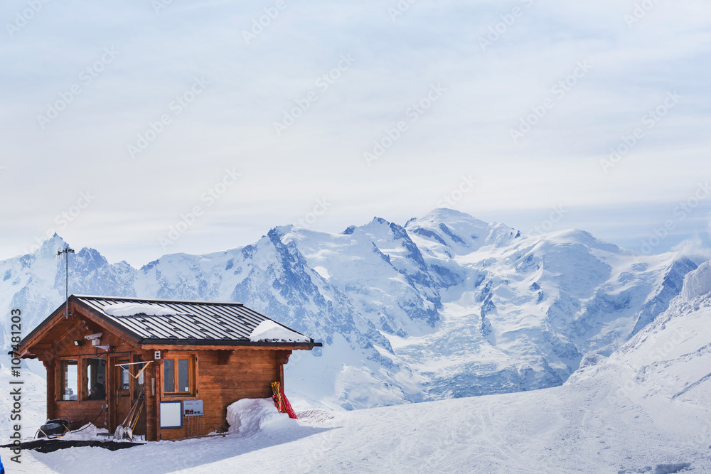 wooden house in winter mountains