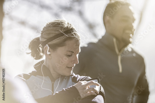Close up of athlete using mp3 player