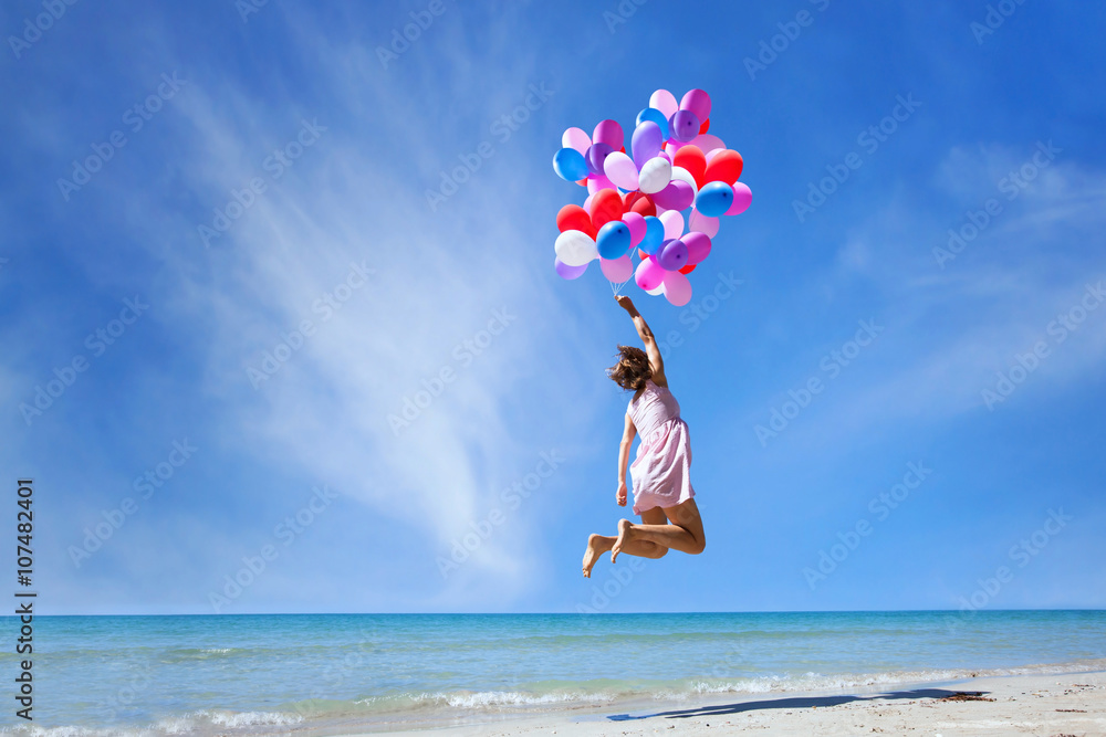 dream concept, girl flying on multicolored balloons in blue sky, imagination and creativity - obrazy, fototapety, plakaty 
