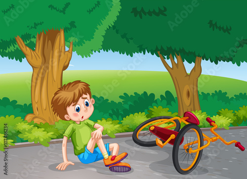 Boy falling down from bike in the park