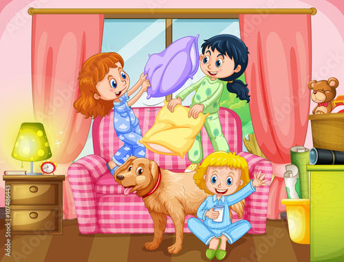 Girls playing pillow fight in living room