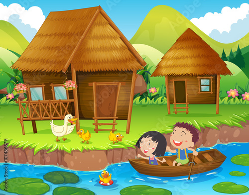 Two kids rowing boat in the river