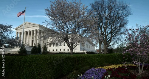 The US Supreme Court Wide full building slo motion with flowers blooming.mp4