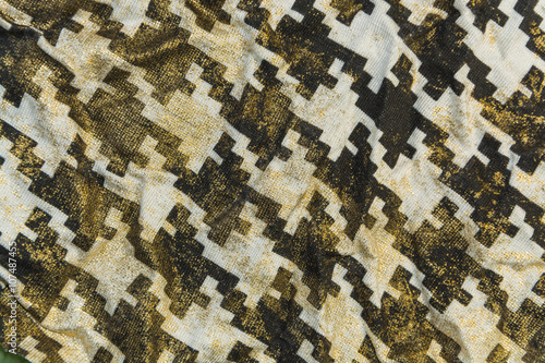 Golden knitted fabric with the pattern of goose foot