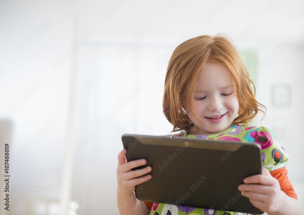 Caucasian girl using digital tablet Caucasian girl using digital tablet