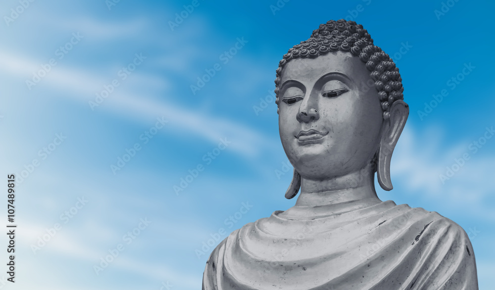 Portrait of old buddha statue on blue sky background at public temple in Thailand. Portrait of old buddha statue on blue sky background at public temple in Thailand.