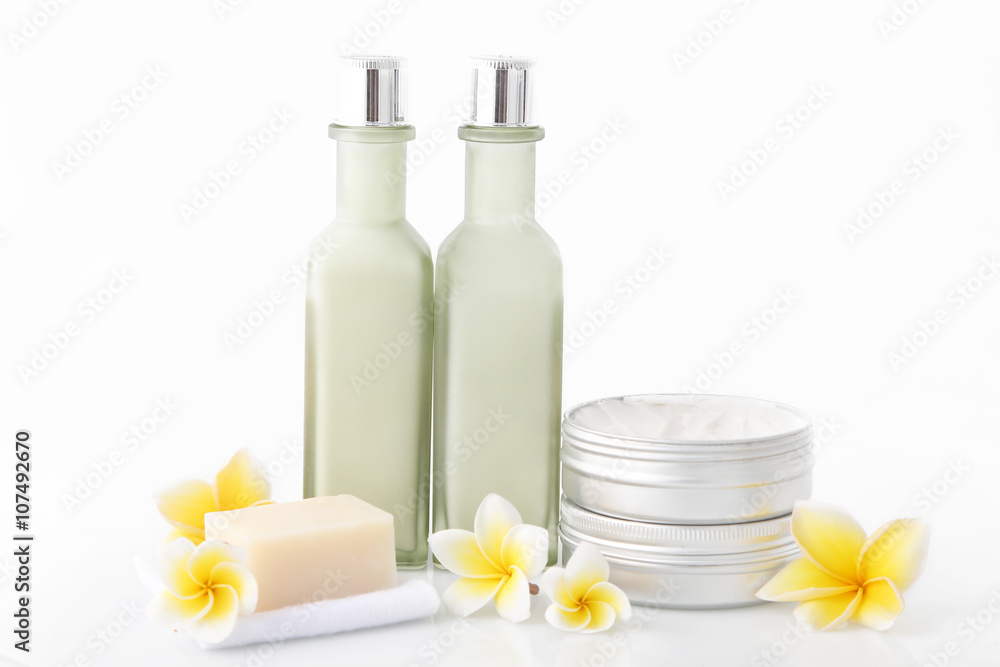 Set of different cosmetic product with frangipani flowers