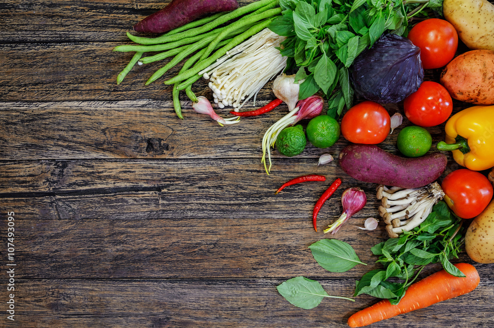 Fresh Vegetables on Wooden Background. Healthy Food. Vegetarian food, Organic Food. Vegetables on wooden table from above.