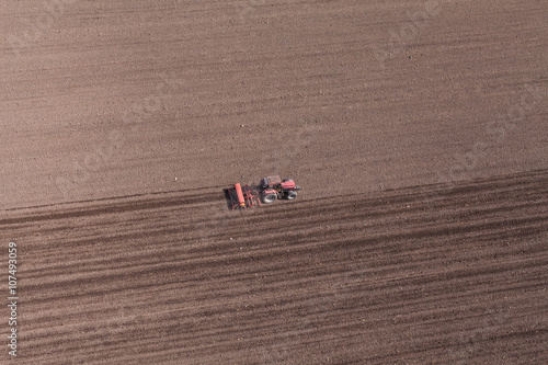 aerial view of  tractor on harvest field