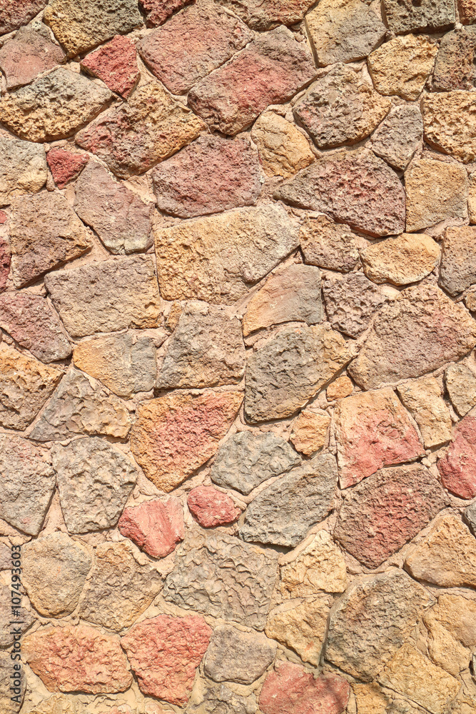 The grunge stone brick wall pattern of exterior building.