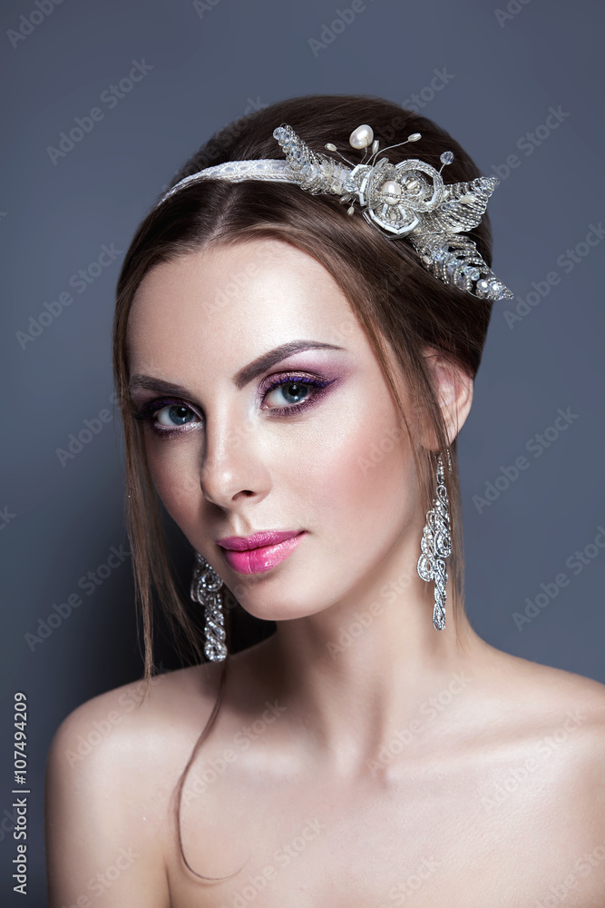 Beautiful young bride with wedding makeup on studio background Beautiful young bride with wedding makeup on studio background