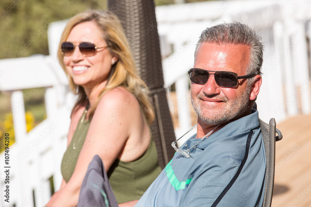 Happy, healthy couple outside on sunny day Happy, healthy couple outside on sunny day