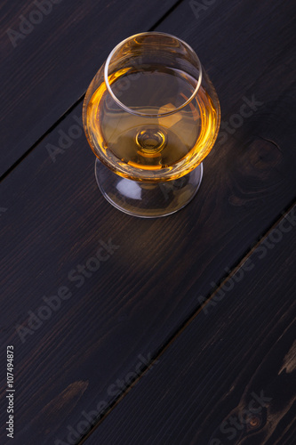 Brandy on dark wood