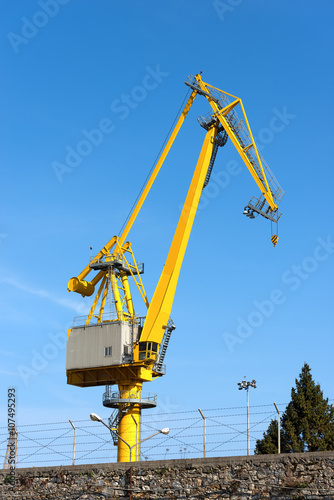 Wallpaper Mural Large yellow and orange crane in the harbor of La Spezia, Liguria, Italy Torontodigital.ca