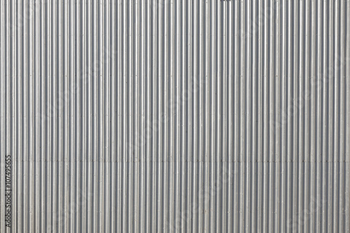 Fototapeta Naklejka Na Ścianę i Meble -  Corrugated metal roof picture taken from above, industrial background or texture.