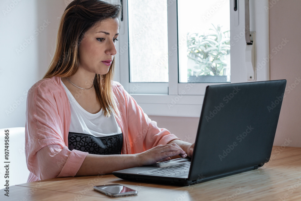 Young woman using her computer Young woman using her computer