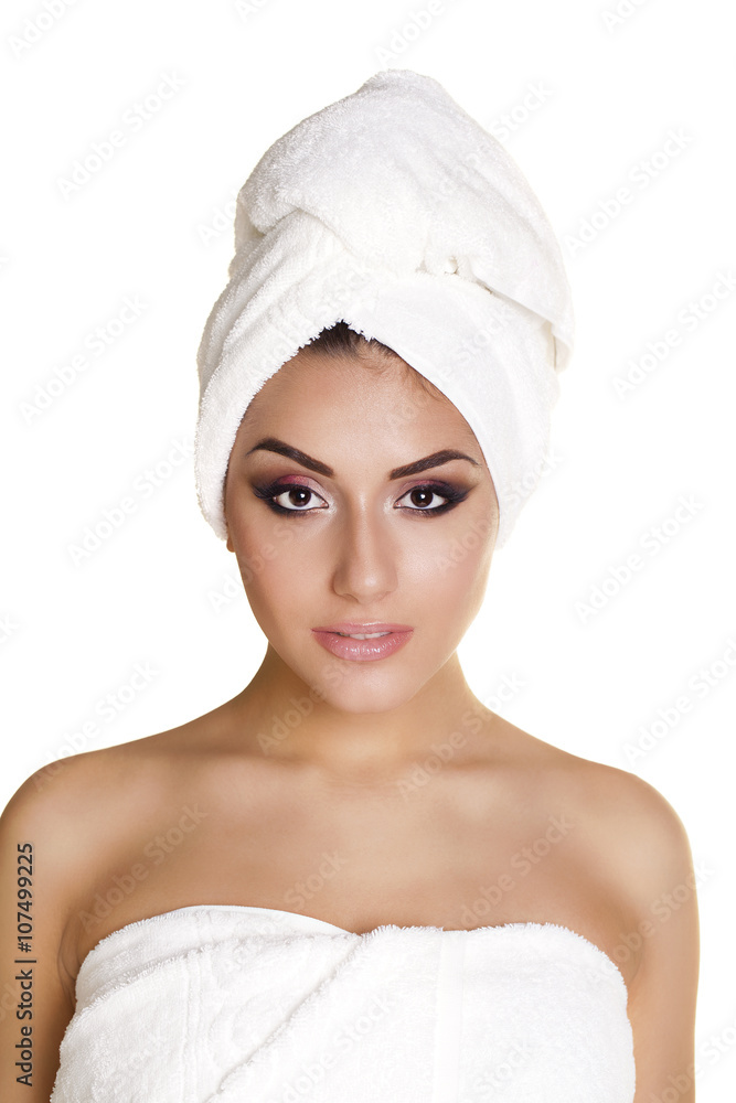 Beautiful young ethnic woman in white towel Beautiful young ethnic woman in white towel