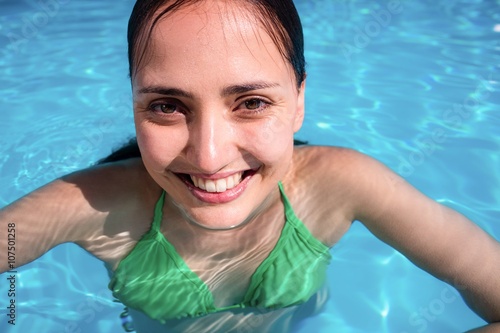Portrait of smiling woman in swimming pool