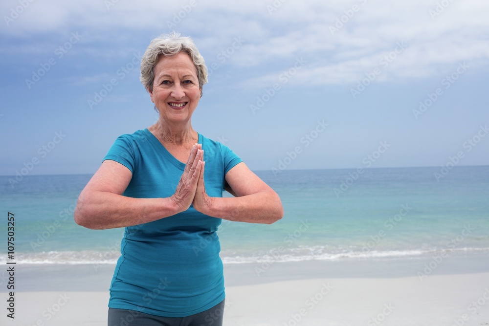 Portrait of happy senior woman in lotus position Portrait of happy senior woman in lotus position