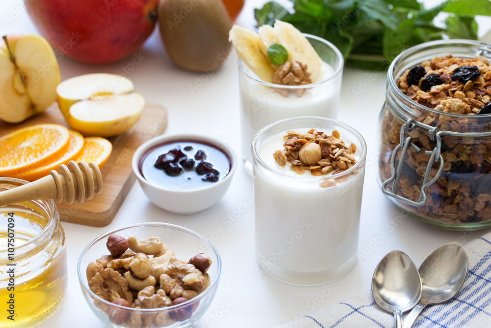 Healthy breakfast with yogurt in glass, granola and fruits Healthy breakfast with yogurt in glass, granola and fruits
