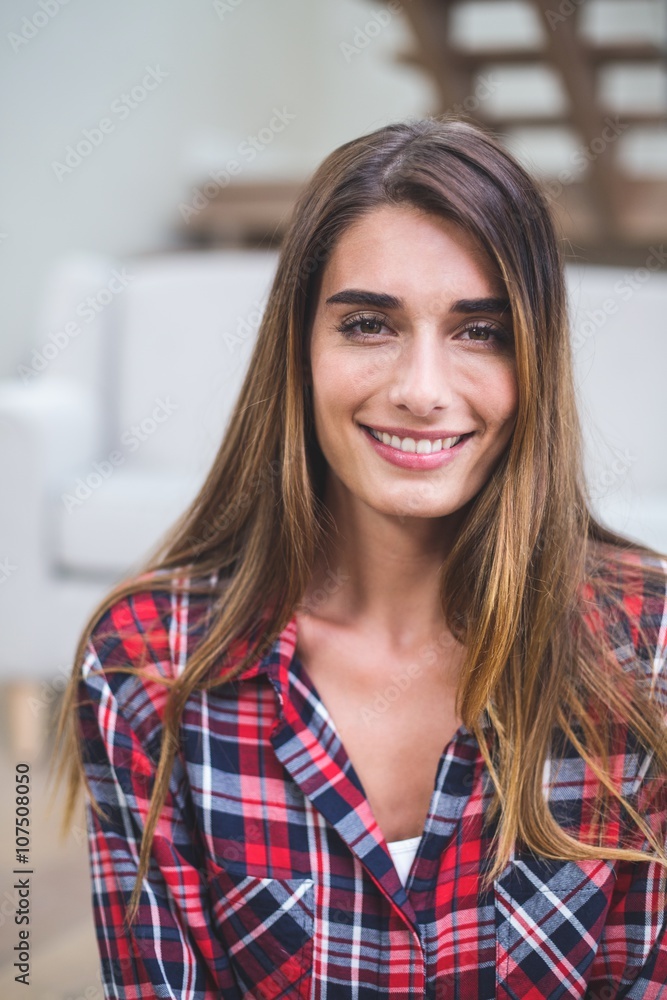 Beautiful woman smiling in living room Beautiful woman smiling in living room