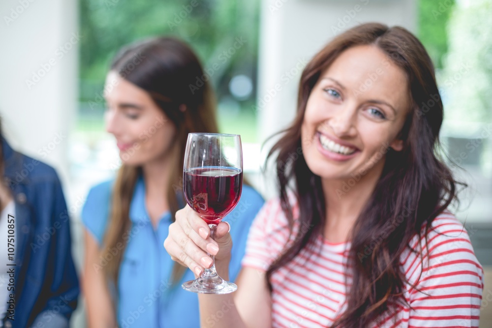 Beautiful woman holding a glass of red wine Beautiful woman holding a glass of red wine