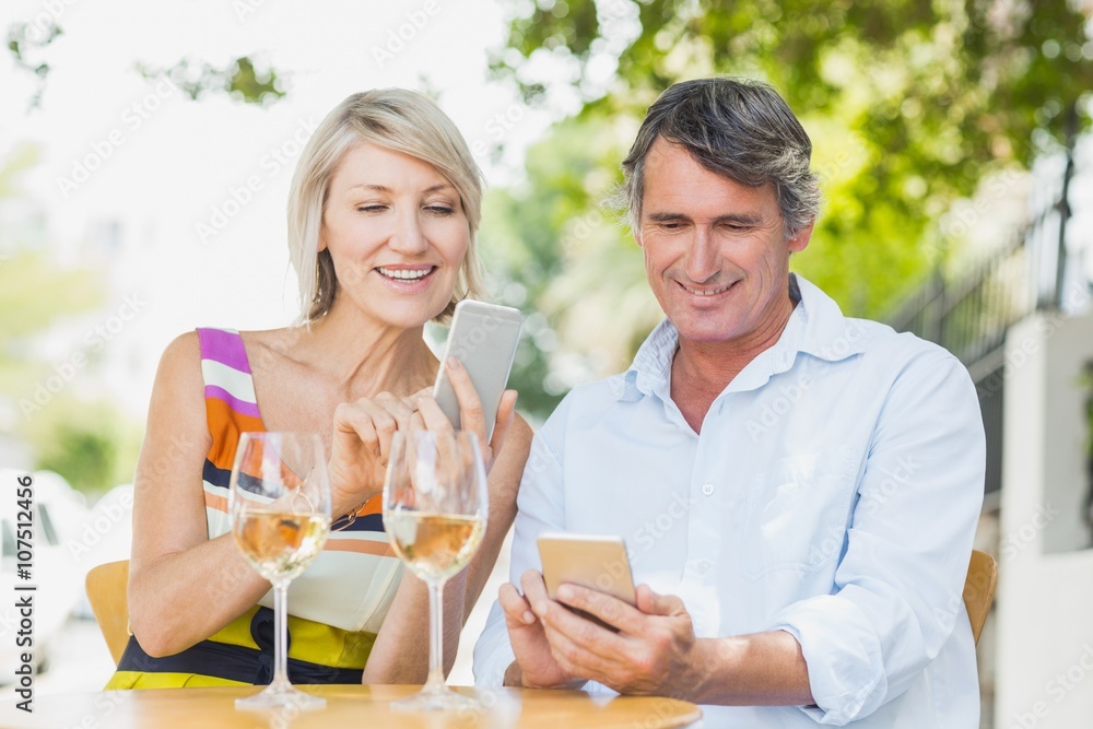 Happy couple using mobile phone Happy couple using mobile phone