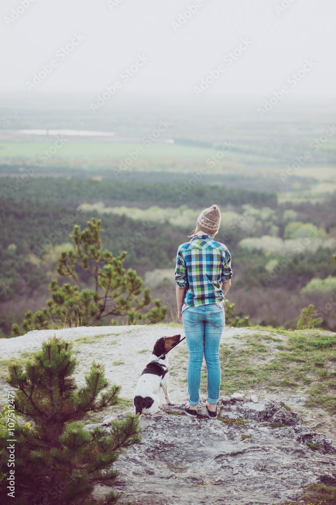 Fototapeta premium Woman and her dog posing outdoor. 