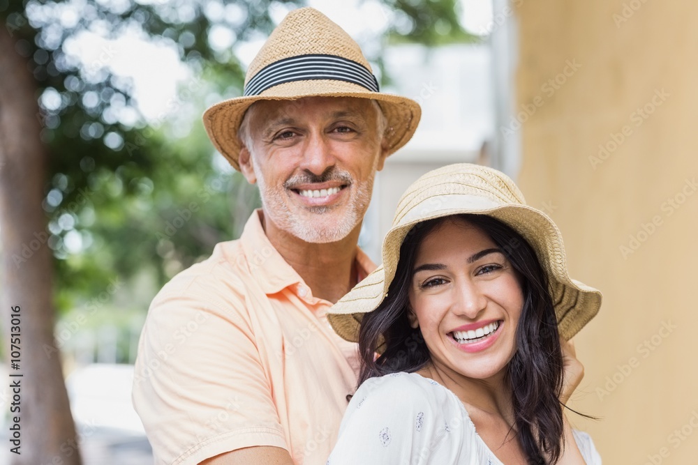 Smiling couple wearing hats